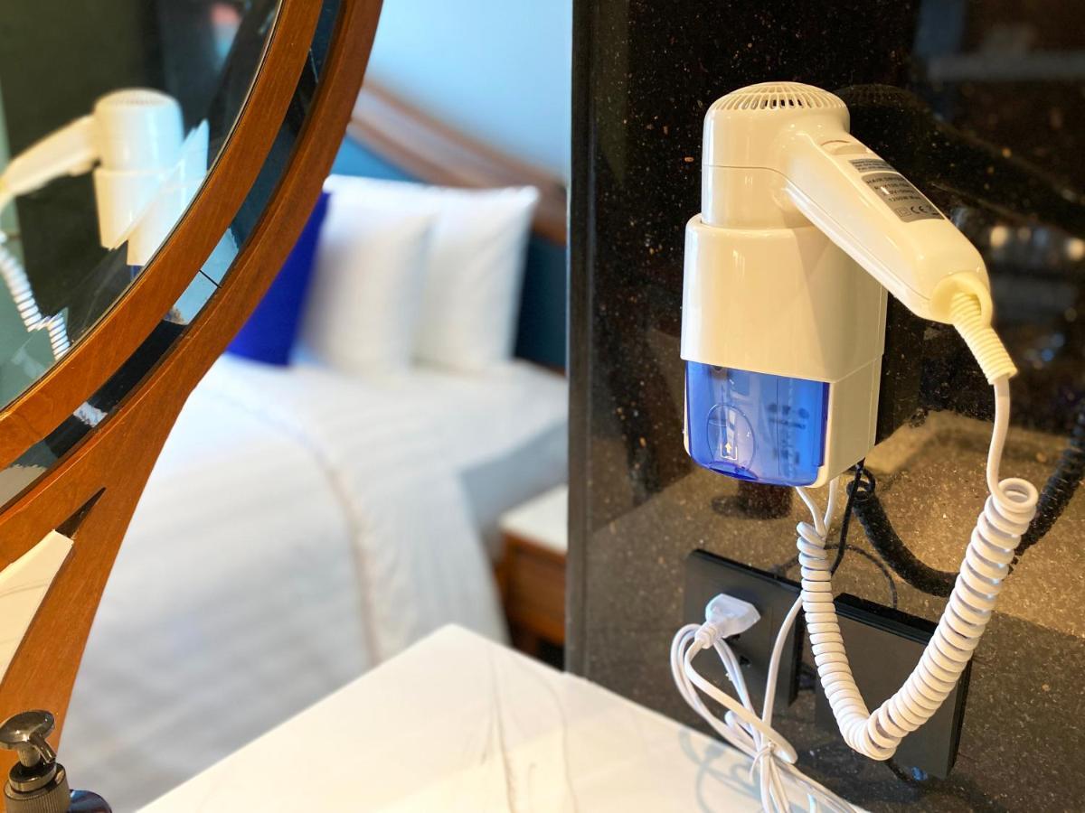 The Oceanic Sportel Phuket - Sha Extra Plus 外观 照片 A hair dryer mounted on a wall